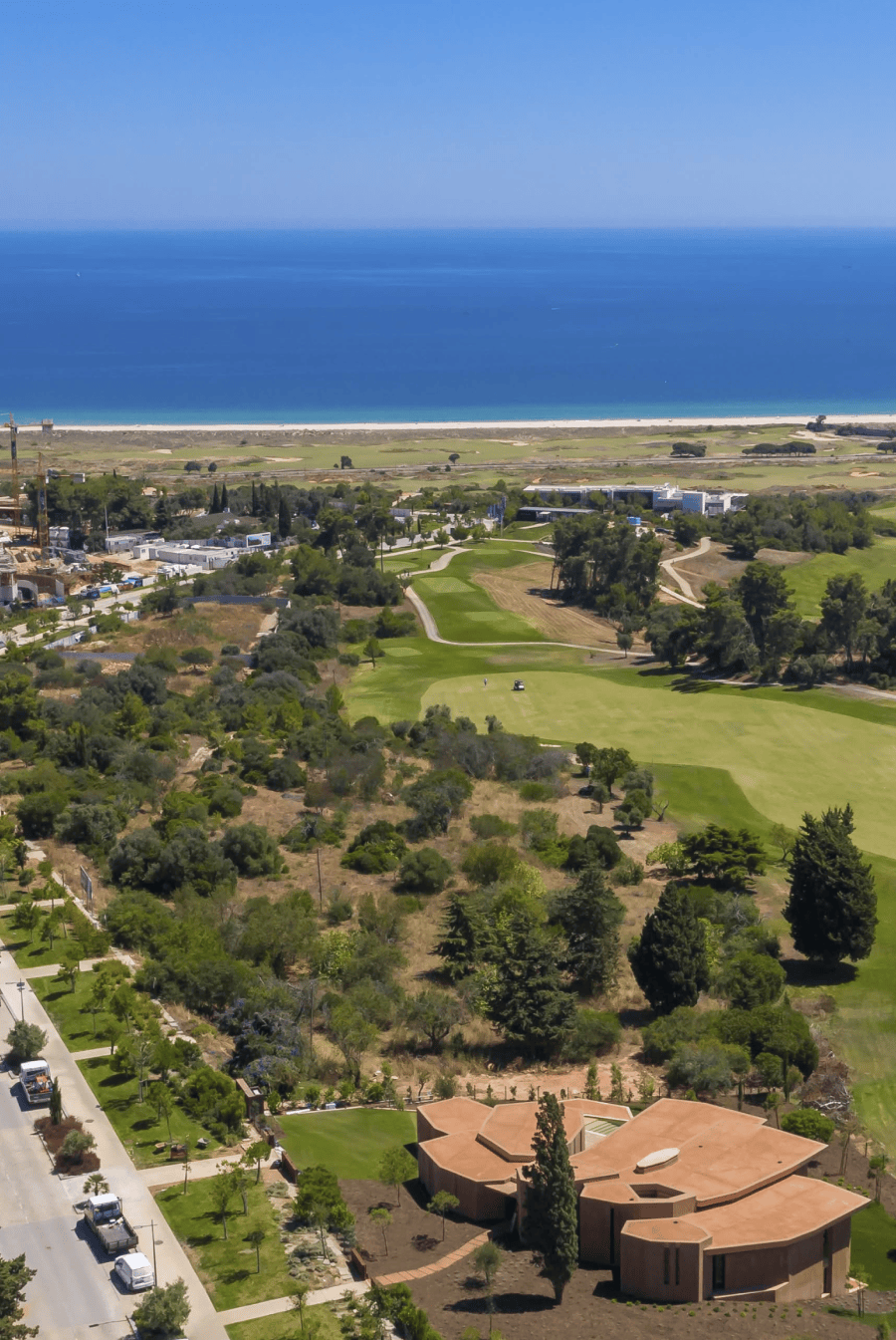 Aerial view of Palmares golf course and branded residences with panoramic ocean views in Lagos, Algarve.