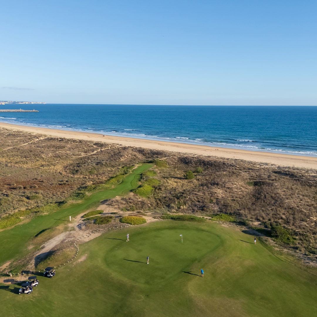 Seaside green and dunes at Palmares Golf, with Atlantic Ocean views near Lagos, Algarve.