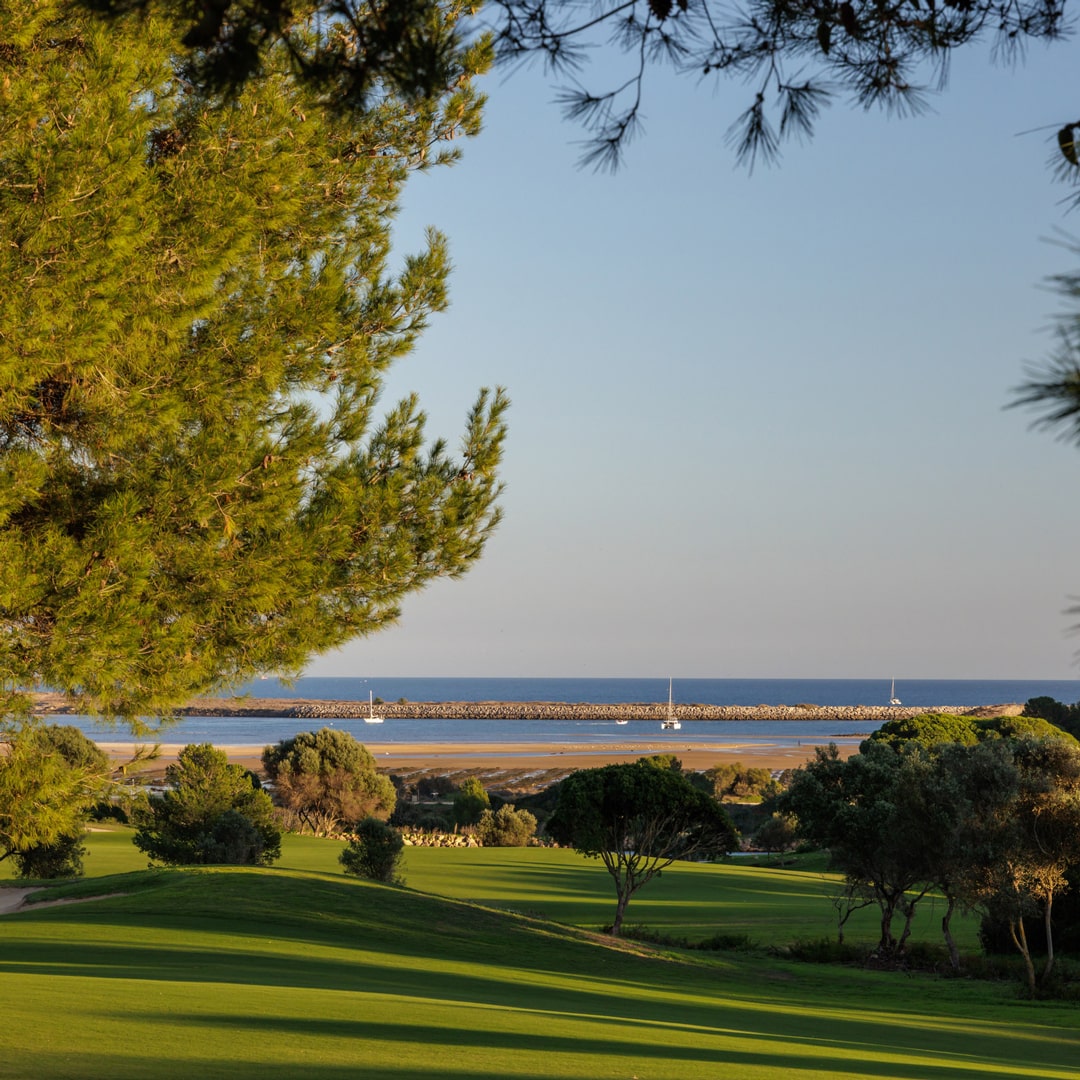 Parkland fairways and coastal marina views at Palmares Golf, Lagos, Algarve, Portugal.